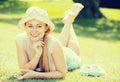 Smiling young woman lying on grass Royalty Free Stock Photo