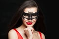 Smiling young woman with makeup and carnival mask Royalty Free Stock Photo