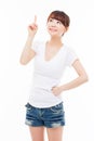 Smiling young woman pointing upwards Royalty Free Stock Photo