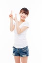 Smiling young woman pointing upwards Royalty Free Stock Photo