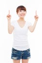 Smiling young woman pointing upwards Royalty Free Stock Photo