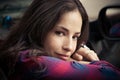 Smiling young woman portrait sit in car leaning on window Royalty Free Stock Photo