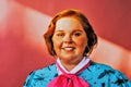 smiling young woman portrait in studio over pink background