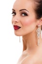 Smiling young woman posing with bright red lips and jewellery, Royalty Free Stock Photo