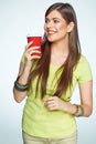 Smiling young woman posing on white background with coffee cup. Royalty Free Stock Photo