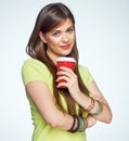 Smiling young woman posing on white background with coffee cup. Royalty Free Stock Photo