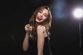 Smiling young woman with red lips holding glass of champagne Royalty Free Stock Photo