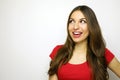 Smiling young woman with red t-shirt looking to the side on white background. Copy space Royalty Free Stock Photo