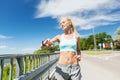 Smiling young woman running outdoors Royalty Free Stock Photo