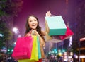 Smiling young woman with shopping bags Royalty Free Stock Photo