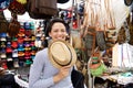 Smiling young woman at shopping market