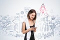 Smiling woman with phone and her startup project Royalty Free Stock Photo