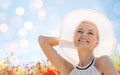 Smiling young woman in straw hat on poppy field Royalty Free Stock Photo