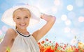 Smiling young woman in straw hat on poppy field Royalty Free Stock Photo