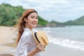 Smiling young woman in sun hat on beach. summer, holidays, vacation, travel concept Royalty Free Stock Photo