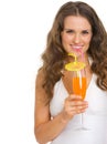 Smiling young woman in swimsuit drinking cocktail Royalty Free Stock Photo