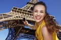 Smiling young woman taking photo with camera in Paris, France Royalty Free Stock Photo