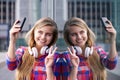 Smiling young woman taking selfie with peace hand sign Royalty Free Stock Photo