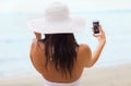 Smiling young woman taking selfie with smartphone Royalty Free Stock Photo