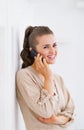 Smiling young woman talking cell phone Royalty Free Stock Photo