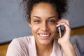 Smiling young woman talking on mobile phone Royalty Free Stock Photo