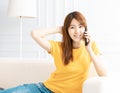 Smiling young Woman talking on the phone at home Royalty Free Stock Photo