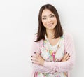 Smiling Young woman teenager arms crossed, in pink