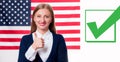 Smiling young woman on United States flag background. Royalty Free Stock Photo