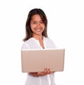 Smiling young woman using her laptop computer