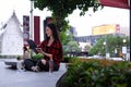 Smiling young woman using laptop computer while sitting in the city park Royalty Free Stock Photo