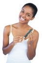 Smiling young woman using nail file Royalty Free Stock Photo