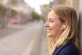 Smiling young woman waiting for her bus Royalty Free Stock Photo