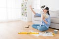 Smiling young woman wearing VR technology goggles Royalty Free Stock Photo