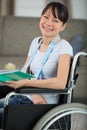 smiling young woman in wheelchair looking at camera Royalty Free Stock Photo