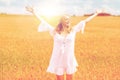 Smiling young woman in white dress on cereal field Royalty Free Stock Photo