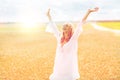 Smiling young woman in white dress on cereal field Royalty Free Stock Photo