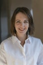 Smiling young woman in white shirt. Business woman in formal clothes. Portrait of middle aged woman Royalty Free Stock Photo