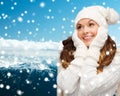 Smiling young woman in white winter clothes Royalty Free Stock Photo