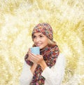 Smiling young woman in winter clothes with cup Royalty Free Stock Photo