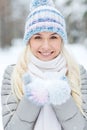 Smiling young woman in winter forest Royalty Free Stock Photo