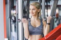 smiling young woman working out with dumbbells Royalty Free Stock Photo