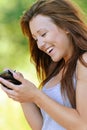 Smiling young woman writing on