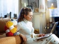 Smiling young woman with yarn learn how to knit Royalty Free Stock Photo