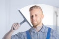 Worker Cleaning Glass Window With Squeegee Royalty Free Stock Photo