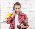 Smiling young worker phone, in his studio Royalty Free Stock Photo