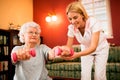 Smilinig positive senior woman enjoy in exercise with nurse Royalty Free Stock Photo