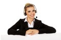 Smille call center woman holding empty banner. Royalty Free Stock Photo