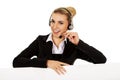 Smille call center woman holding empty banner. Royalty Free Stock Photo