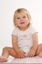 Smilling blonde little girl in white T-shirt