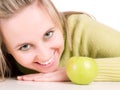 Smilling girl and green apple Royalty Free Stock Photo